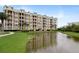 Building exterior overlooking a pond at 4672 Riverwalk Village Ct # 8201, Ponce Inlet, FL 32127