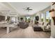 Bright living room featuring hardwood floors, ample seating and a view at 4672 Riverwalk Village Ct # 8201, Ponce Inlet, FL 32127