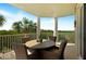 Private balcony with outdoor seating and scenic views at 4672 Riverwalk Village Ct # 8201, Ponce Inlet, FL 32127