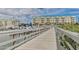 Wooden walkway leads to waterfront property with boat slips at 4672 Riverwalk Village Ct # 8201, Ponce Inlet, FL 32127