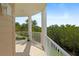 Peaceful balcony overlooking lush greenery and a bright sky at 4672 Riverwalk Village Ct # 8201, Ponce Inlet, FL 32127
