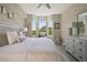 Spacious bedroom with king-size bed and large windows at 4672 Riverwalk Village Ct # 8201, Ponce Inlet, FL 32127