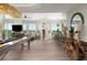 Spacious living room with hardwood floors, large windows, and comfortable seating at 4672 Riverwalk Village Ct # 8201, Ponce Inlet, FL 32127