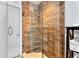 Spacious shower with glass enclosure and wood-look tile at 4111 S Atlantic Ave, Port Orange, FL 32127