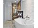 Spa-like bathroom with a large soaking tub and walk-in shower at 4111 S Atlantic Ave, Port Orange, FL 32127