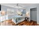 Cozy bedroom with hardwood floors and ample natural light at 4111 S Atlantic Ave, Port Orange, FL 32127