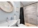 Clean bathroom with walk-in shower and wood-look tile at 4111 S Atlantic Ave, Port Orange, FL 32127