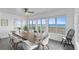 Bright dining area with ocean views and a wooden table for six at 4111 S Atlantic Ave, Port Orange, FL 32127