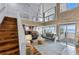 High-ceiling living room with hardwood floors and ocean views at 4111 S Atlantic Ave, Port Orange, FL 32127