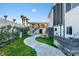 Stone pathway meanders through grassy area toward beach at 4111 S Atlantic Ave, Port Orange, FL 32127