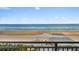 Stunning ocean view from private balcony, showing beach and surfers at 4111 S Atlantic Ave, Port Orange, FL 32127
