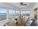 Spacious dining room offering stunning ocean views and wooden table at 4111 S Atlantic Ave, Port Orange, FL 32127