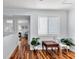Upstairs hallway with hardwood floors and natural light at 4111 S Atlantic Ave, Port Orange, FL 32127