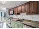 Updated kitchen with stainless steel appliances and granite countertops at 4111 S Atlantic Ave, Port Orange, FL 32127