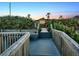 Beach access walkway leading to a beachfront home at 3580 Ocean Shore Blvd, Ormond Beach, FL 32176