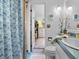Bathroom with shower, vanity, and access to a bedroom closet at 3580 Ocean Shore Blvd, Ormond Beach, FL 32176