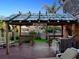 Rustic Tiki bar with thatched roof, providing a shaded area for entertaining at 3580 Ocean Shore Blvd, Ormond Beach, FL 32176