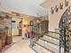 Unique curved staircase with ornate metal railing and tile accents at 3580 Ocean Shore Blvd, Ormond Beach, FL 32176