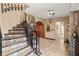 View of a curved staircase with detailed metal railing and colorful tile at 3580 Ocean Shore Blvd, Ormond Beach, FL 32176