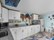 Well-equipped kitchen with white cabinets, granite countertops, and ample storage at 3580 Ocean Shore Blvd, Ormond Beach, FL 32176