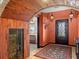Elegant entryway with arched doorway, wood accents, and unique decor at 3580 Ocean Shore Blvd, Ormond Beach, FL 32176