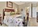 Main bedroom with a plush bed, nightstands, and an ensuite bathroom at 605 Champions Gate, Deland, FL 32724