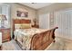 Cozy bedroom featuring a sleigh bed and built-in wardrobe at 605 Champions Gate, Deland, FL 32724