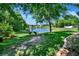 Picturesque backyard featuring a pond and lush grass at 605 Champions Gate, Deland, FL 32724