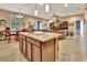 Open concept kitchen with granite island and breakfast bar, overlooking the living room at 605 Champions Gate, Deland, FL 32724