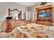 Spacious bedroom with a comfortable bed and mirrored dresser at 605 Champions Gate, Deland, FL 32724