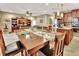 Open dining area with a wood table and chairs, overlooking the kitchen and living room at 605 Champions Gate, Deland, FL 32724