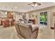 Open living room with sectional sofa and access to backyard at 605 Champions Gate, Deland, FL 32724