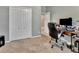 Home office with a desk and built-in closet at 605 Champions Gate, Deland, FL 32724