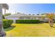 Tan one-story house with attached garage at 100 Talo Cir, Port Orange, FL 32127
