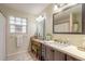 Bathroom with a modern vanity and a large mirror at 100 Talo Cir, Port Orange, FL 32127