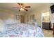 Spacious main bedroom with a large bed and access to a full bathroom at 100 Talo Cir, Port Orange, FL 32127