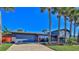 Charming home exterior featuring a brick facade and a spacious driveway at 3 Wisteria Dr, Ormond Beach, FL 32176