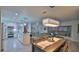 Open concept dining area with kitchen and living room views at 3 Wisteria Dr, Ormond Beach, FL 32176