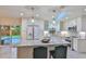 Updated kitchen with granite island and stainless steel appliances at 3 Wisteria Dr, Ormond Beach, FL 32176