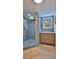 Updated bathroom featuring a walk-in shower and light wood vanity at 3 Wisteria Dr, Ormond Beach, FL 32176