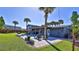 Backyard oasis with a pool, patio, and lush landscaping at 3 Wisteria Dr, Ormond Beach, FL 32176