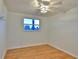 Spacious bedroom with hardwood floors and large window at 3 Wisteria Dr, Ormond Beach, FL 32176