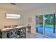 Elegant dining room with sliding doors leading to the pool area at 3 Wisteria Dr, Ormond Beach, FL 32176