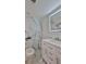 Bathroom with blue and white marble tile and a modern white vanity at 3 Wisteria Dr, Ormond Beach, FL 32176