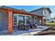 Relaxing front porch with wicker seating and a view of the street at 3 Wisteria Dr, Ormond Beach, FL 32176
