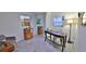 Bright home office features a large desk, comfortable chair, and ample natural light at 3 Wisteria Dr, Ormond Beach, FL 32176