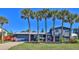 Two-story home with gray siding and palm trees at 3 Wisteria Dr, Ormond Beach, FL 32176