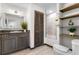 Spa-like bathroom with dark brown vanity, a built-in shower, and floating shelves at 1978 Country Club Dr, Port Orange, FL 32128