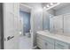 Well-maintained bathroom with vanity, toilet, and access to another room at 1978 Country Club Dr, Port Orange, FL 32128