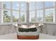 Luxury bathroom featuring a mosaic-tiled soaking tub at 1978 Country Club Dr, Port Orange, FL 32128